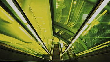 neon green escalator going up