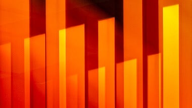 orange abstract bars behind get in touch text
