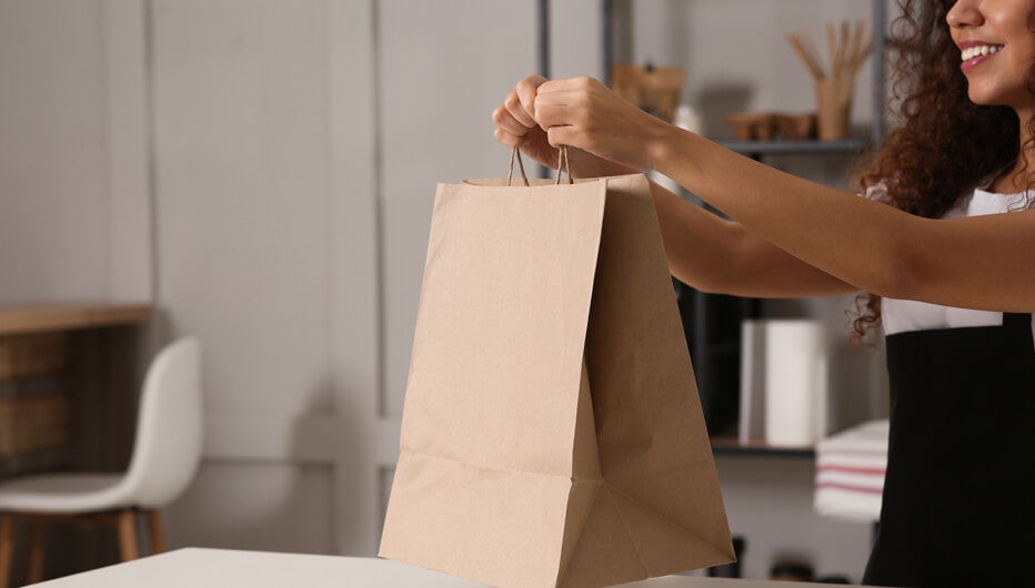 woman and paper bag
